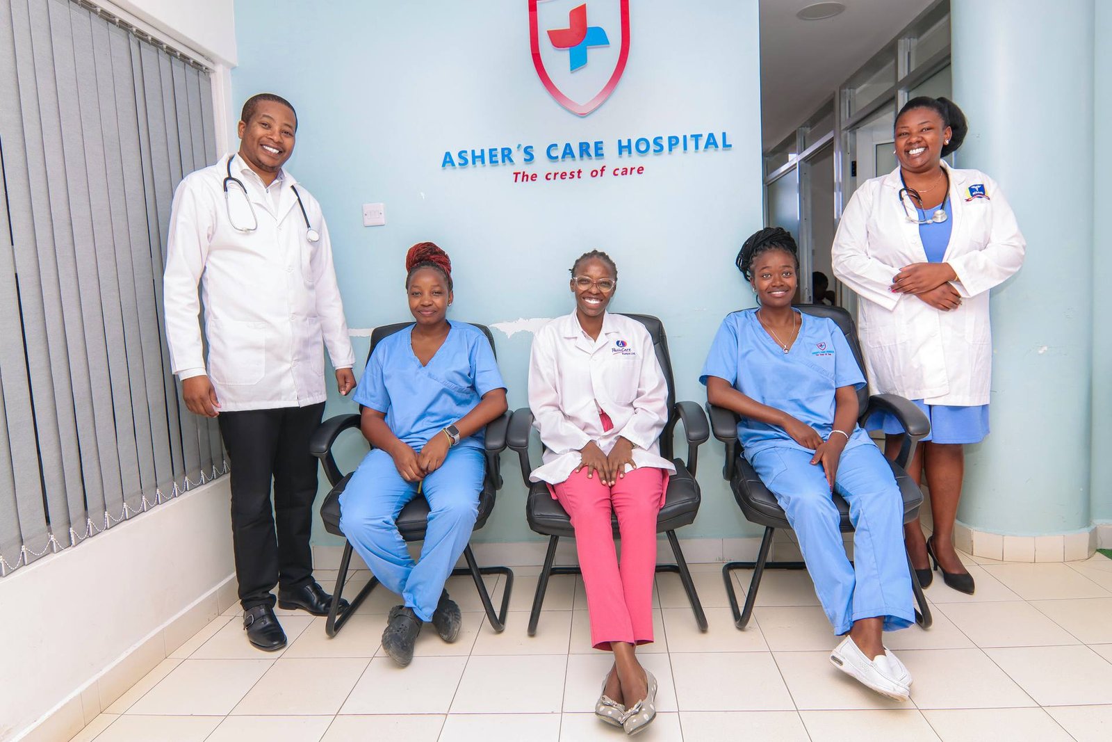 Asher's Care Hospital medical team at the hospital entrance