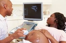 Ultrasound scan being performed on a pregnant patient